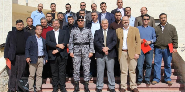 Graduates of the Jan 2015 HD-delivered ToT training holding their certificates. Also in the photo, Mark B. Radley, project Team Leader; Lt Col Zahir, Director of the Jericho Training Facility; and CILC training consultants — Paul Brookes, former UK Police Superintendent, and Riad Mustafa, Palestinian Training Development expert. 